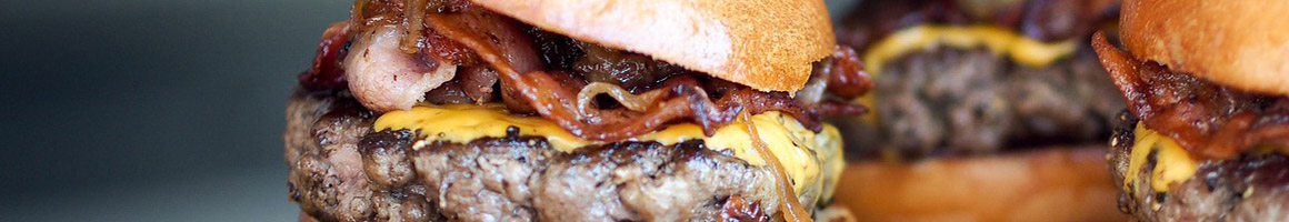 Eating Burger Fast Food at Chris' Hamburgers restaurant in Maywood, CA.